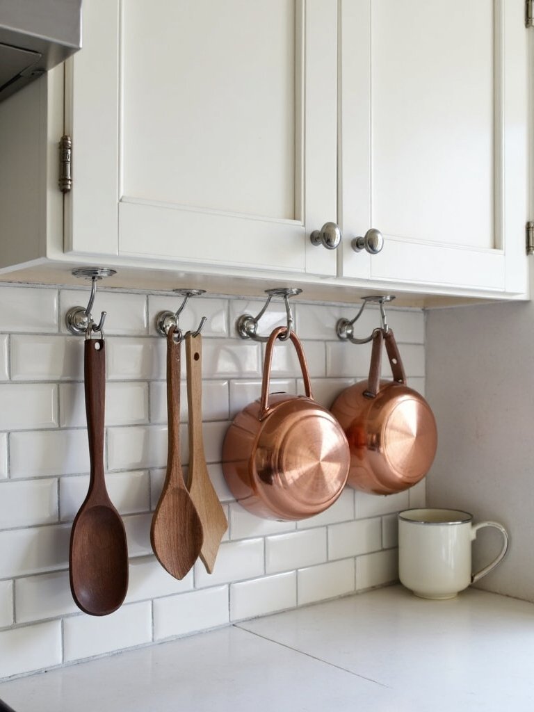 maximize kitchen storage with under cabinet hooks